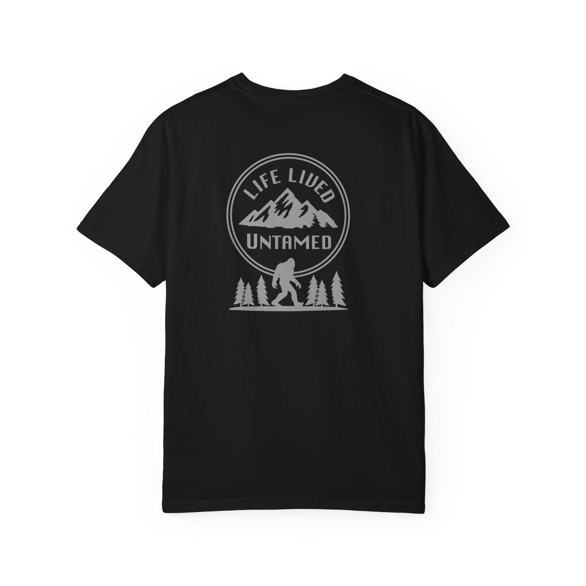 Black t-shirt with a black graphic design on the back featuring mountains, trees, and a silhouette of a Sasquatch