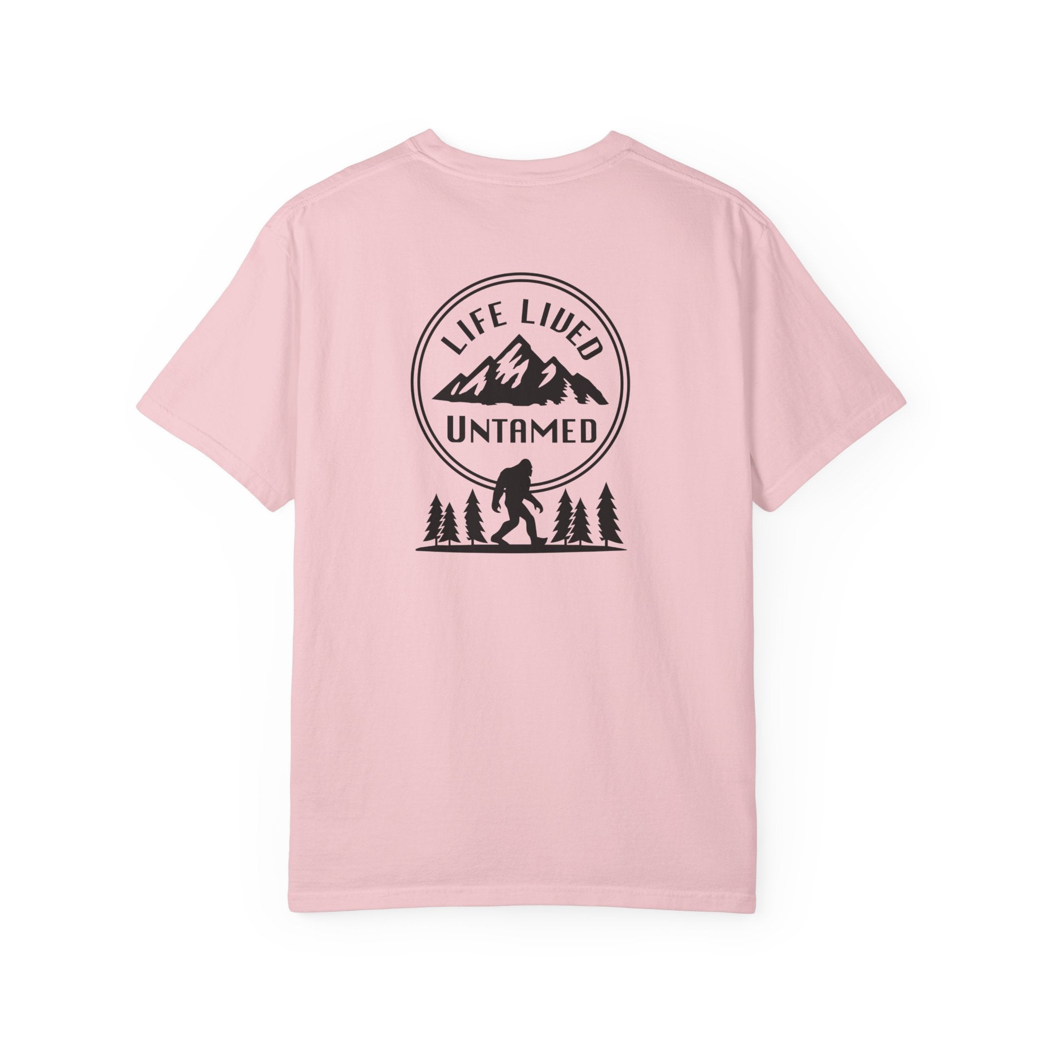 Blossom pink t-shirt with a black graphic design on the back featuring mountains, trees, and a silhouette of a person