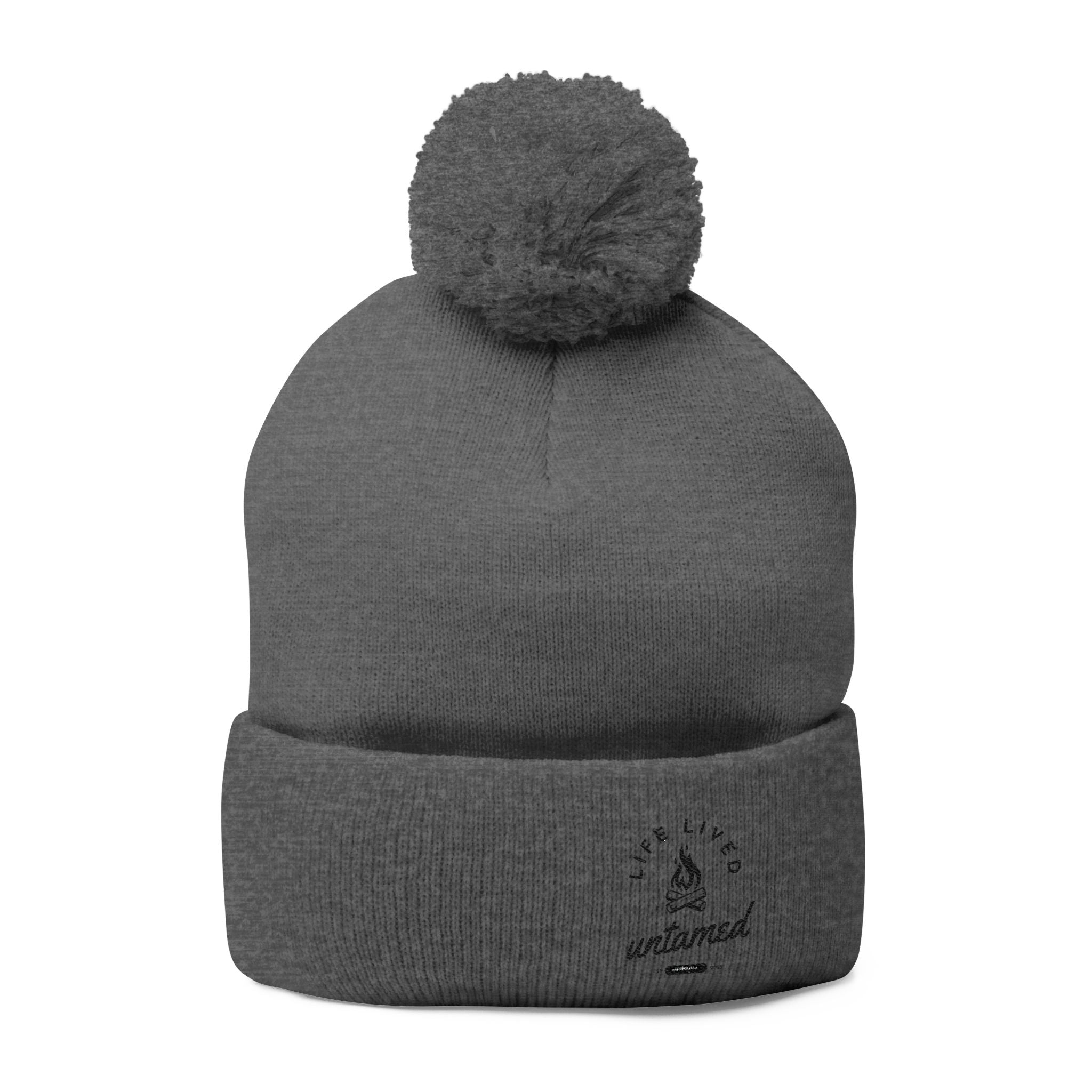 Dark heather gray beanie with pom-pom at the top
