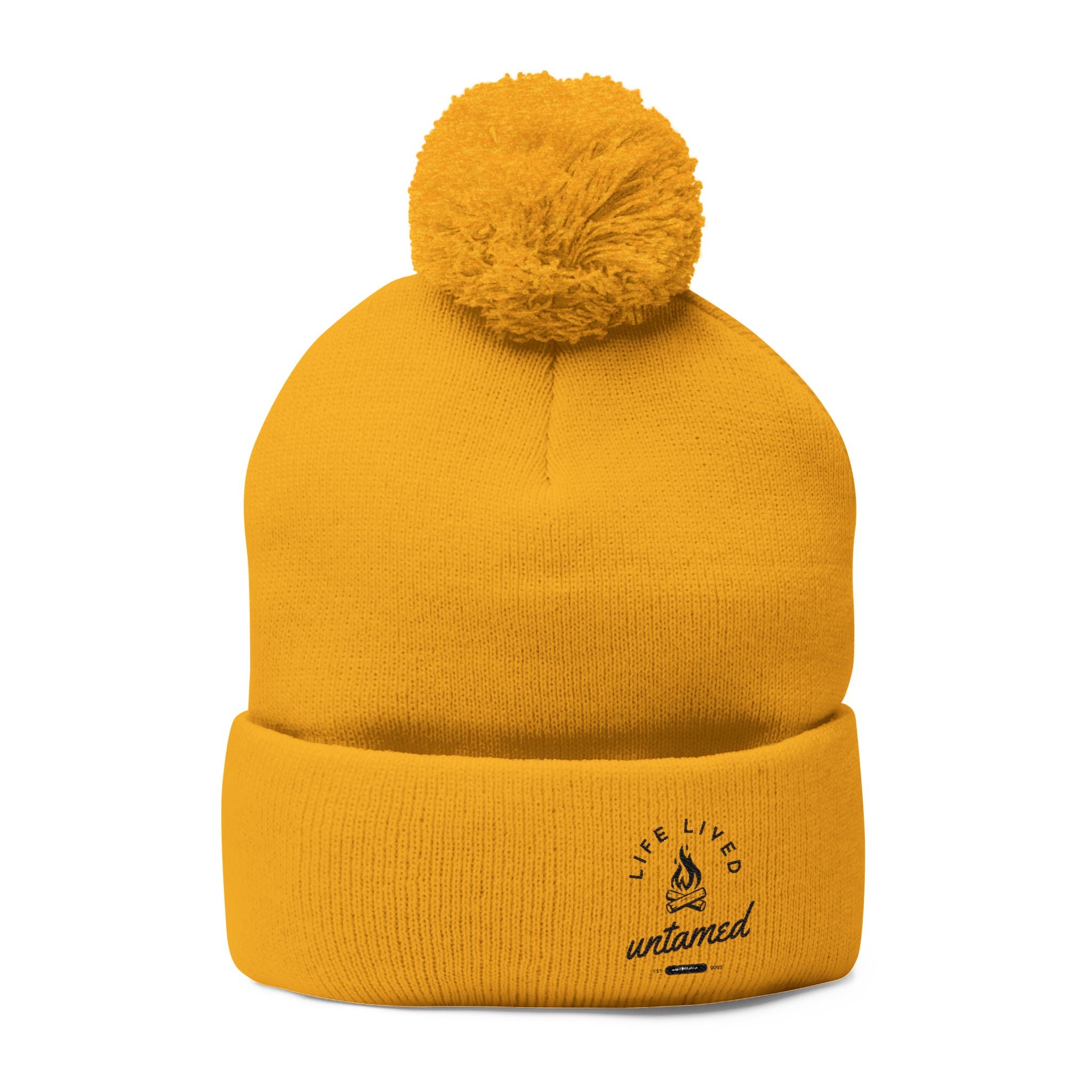 Yellow beanie with pom-pom at the top