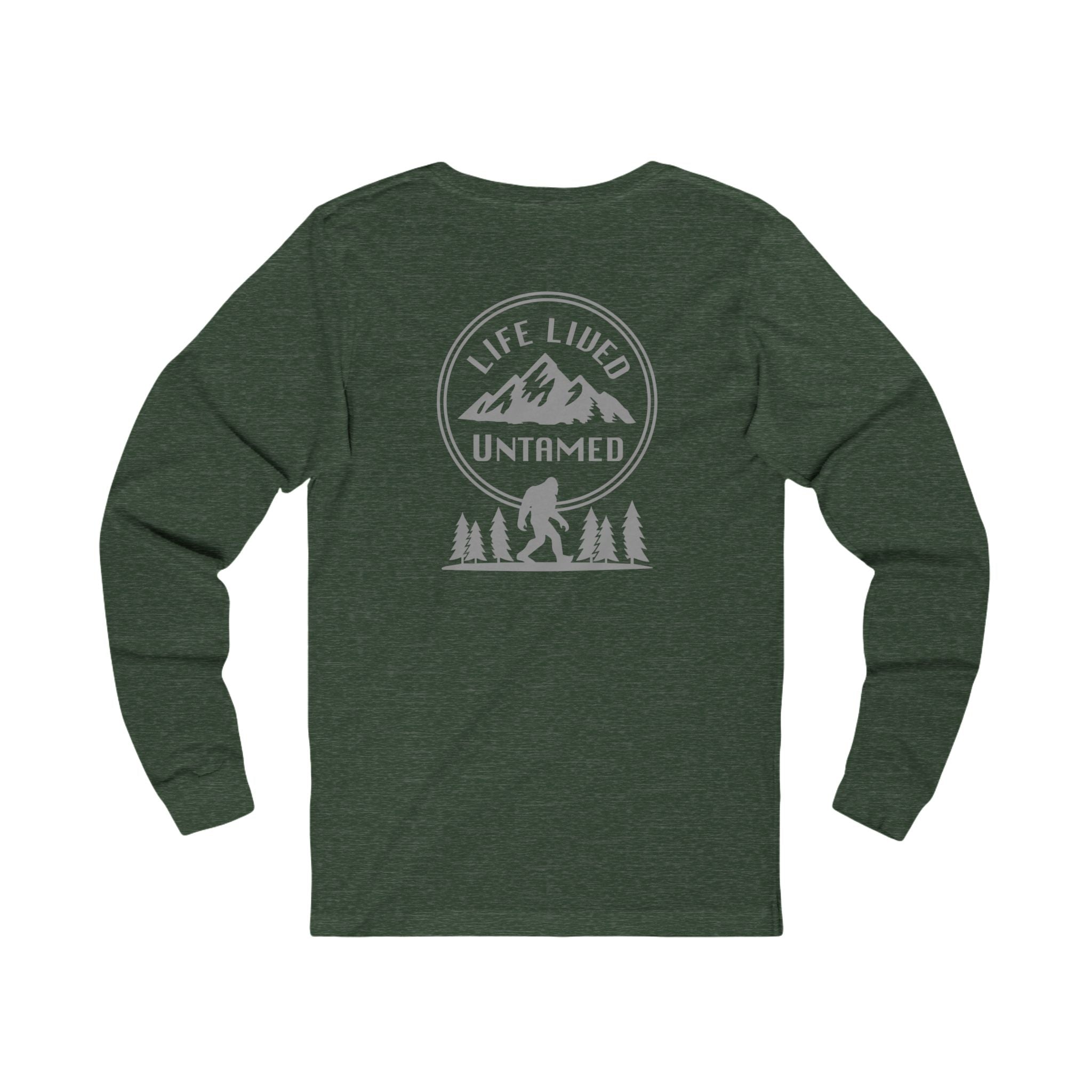 Heather Forest Green long-sleeve shirt with with a black graphic design on the back featuring mountains, trees, and a silhouette of a Sasquatchagainst a white background