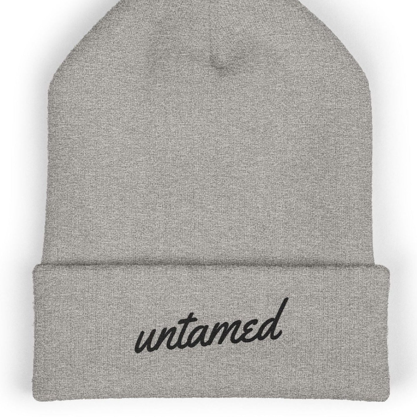 Heather gray beanie with 'untamed' text on a white background