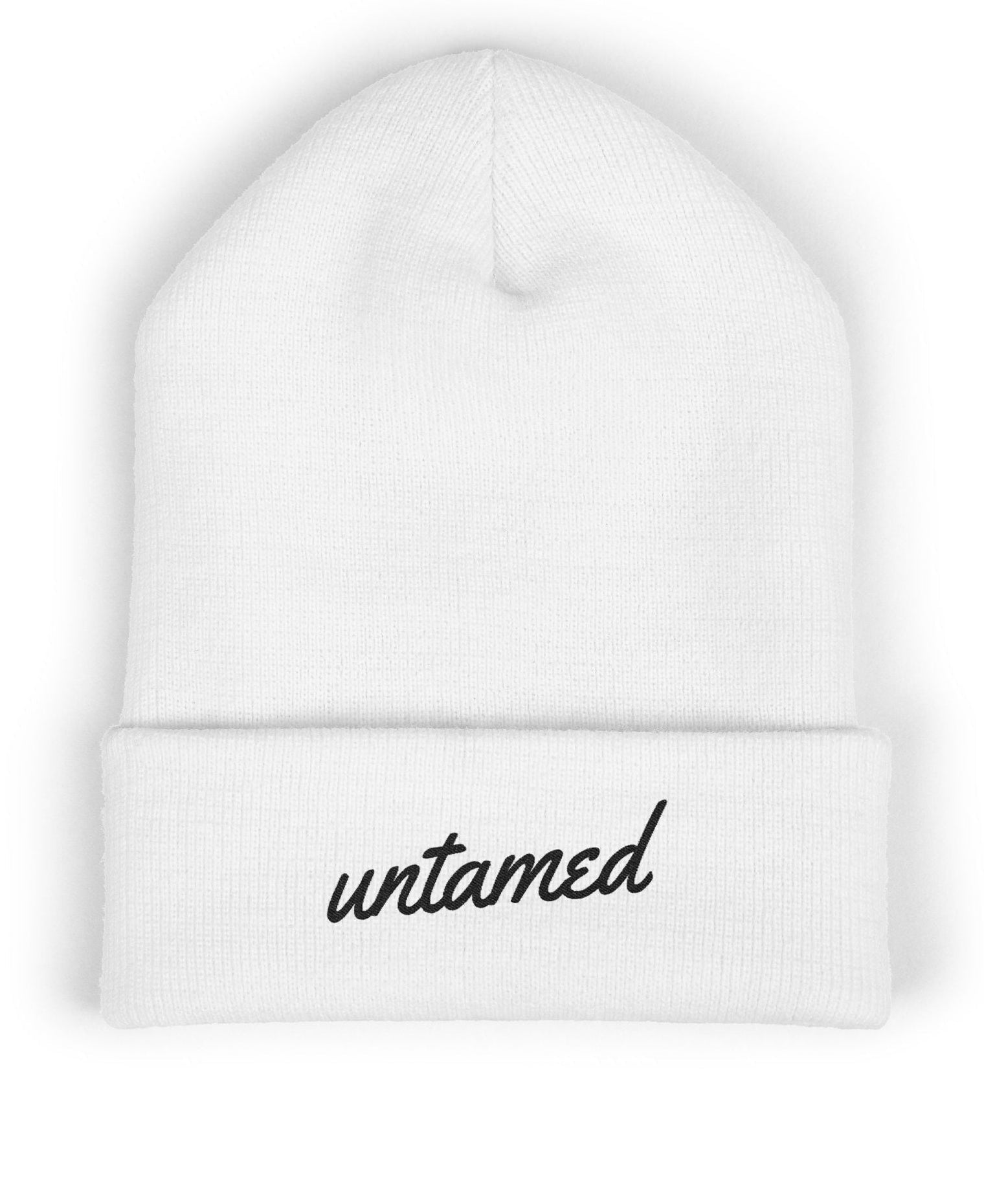White beanie with 'untamed' text on a white background