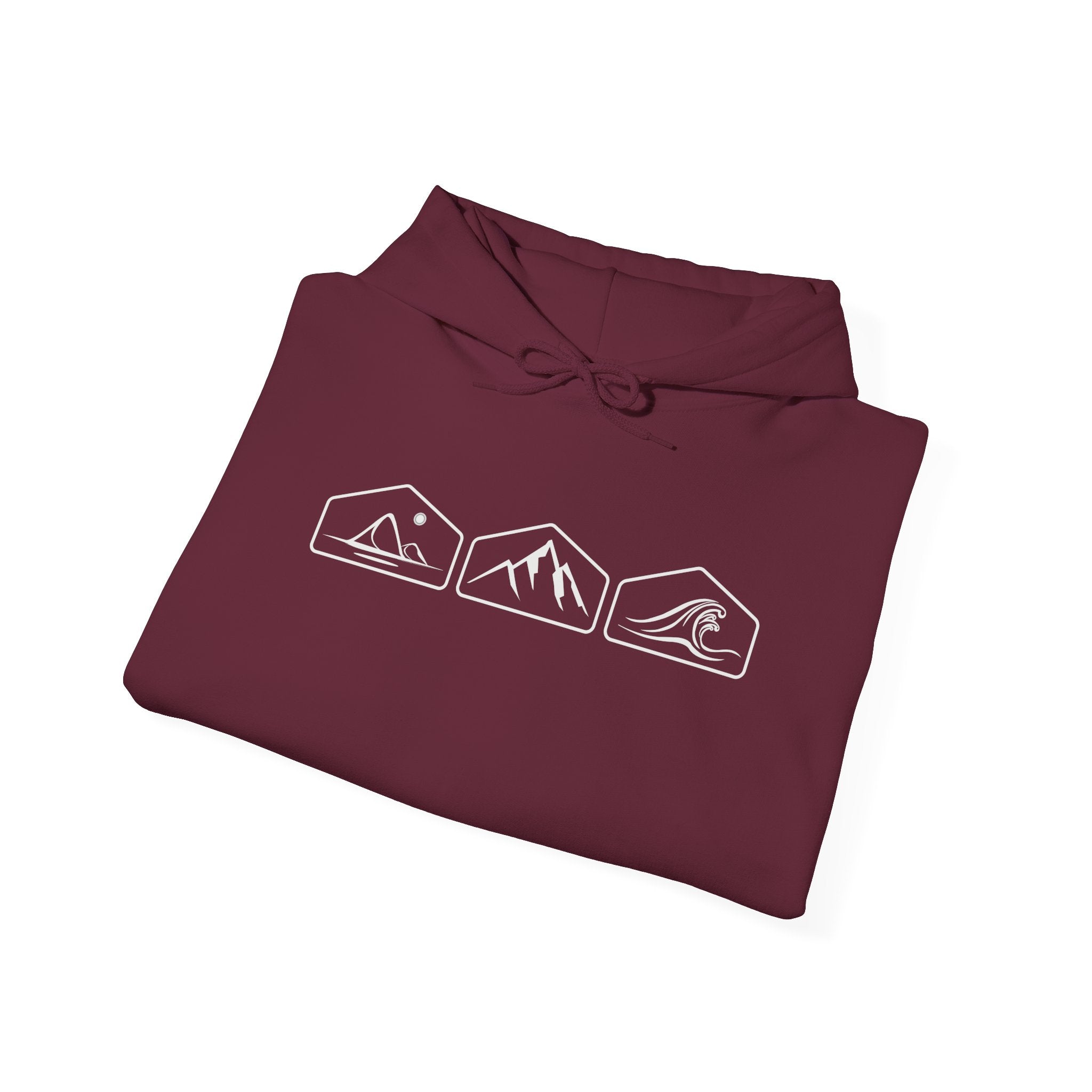 A folded maroon hoodie with white mountain, desert and wave graphics on a white background.
