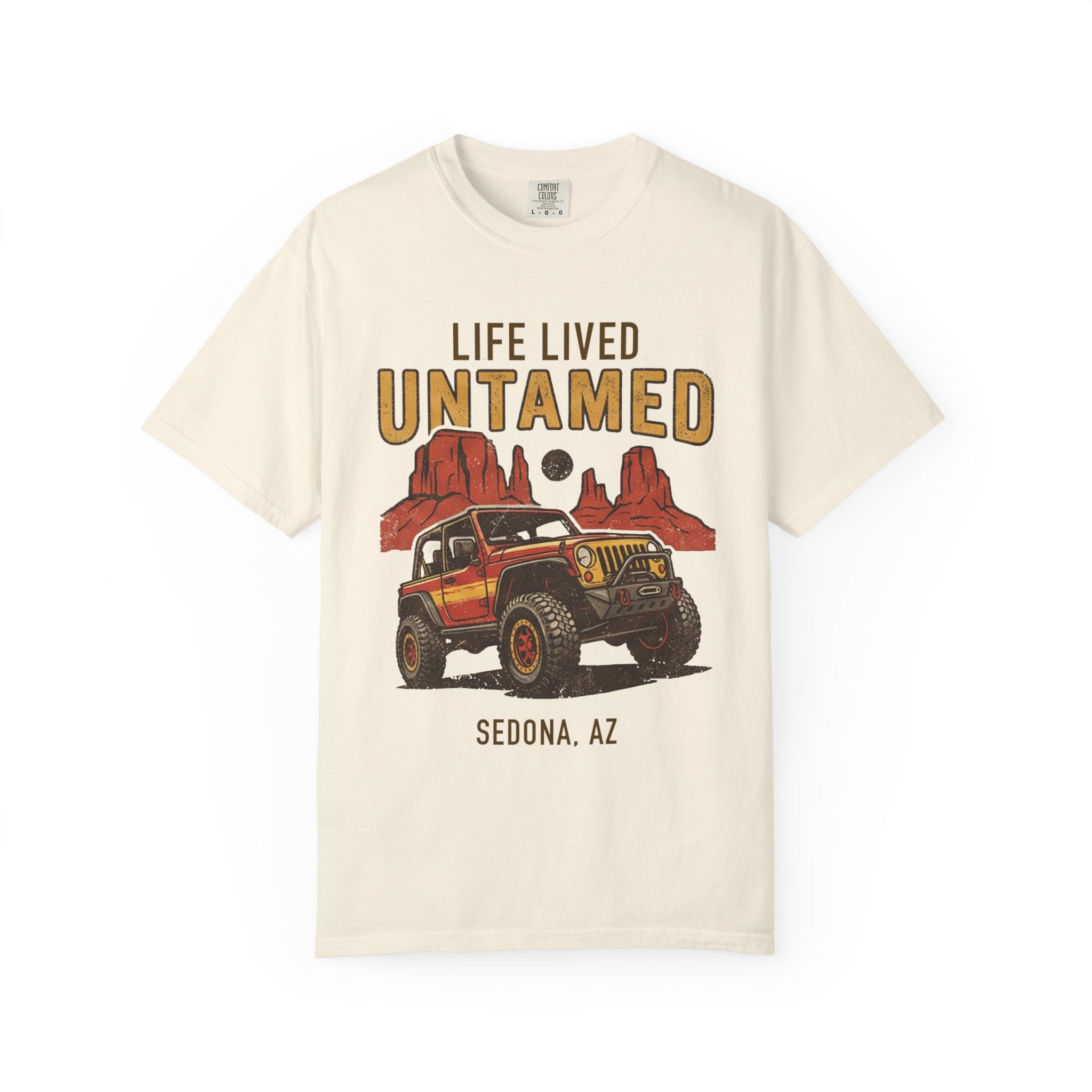 Beige t-shirt with graphic of a Jeep and desert landscape, text 'Life Lived Untamed Sedona, AZ' on a white background