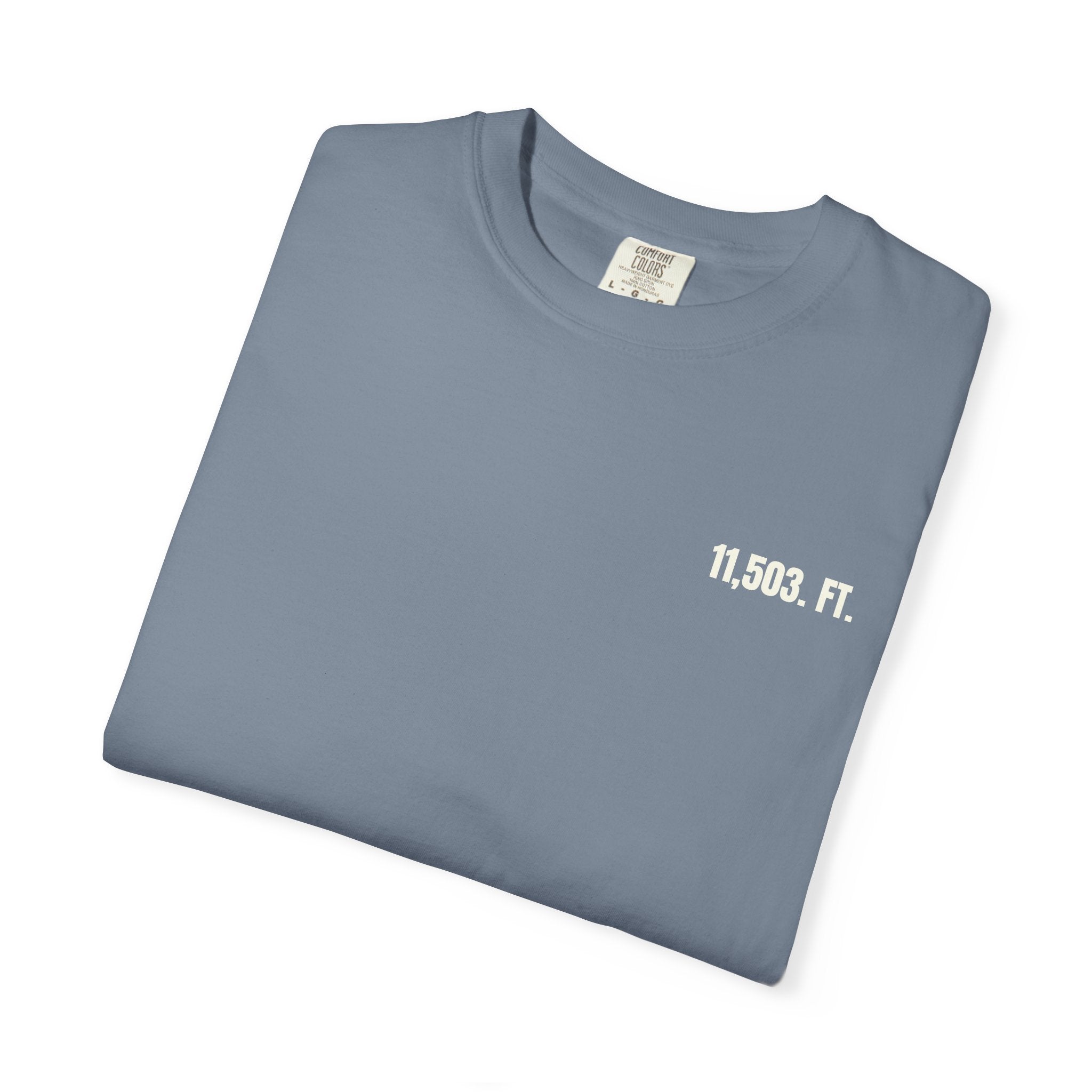 Folded denim blue t-shirt with '11,503. FT.' text on a white background