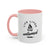 White mug with pink interior and handle, featuring a black graphic and text on a white background.