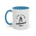 White mug with blue handle and interior, featuring a black graphic and text on a white background