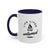 White mug with blue handle and interior, featuring 'Life Lived Untamed' text and campfire graphic.