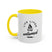 White mug with yellow handle and interior, featuring a black graphic and text on a white background.