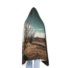 Back side of desert landscape design worn by a person on a white background