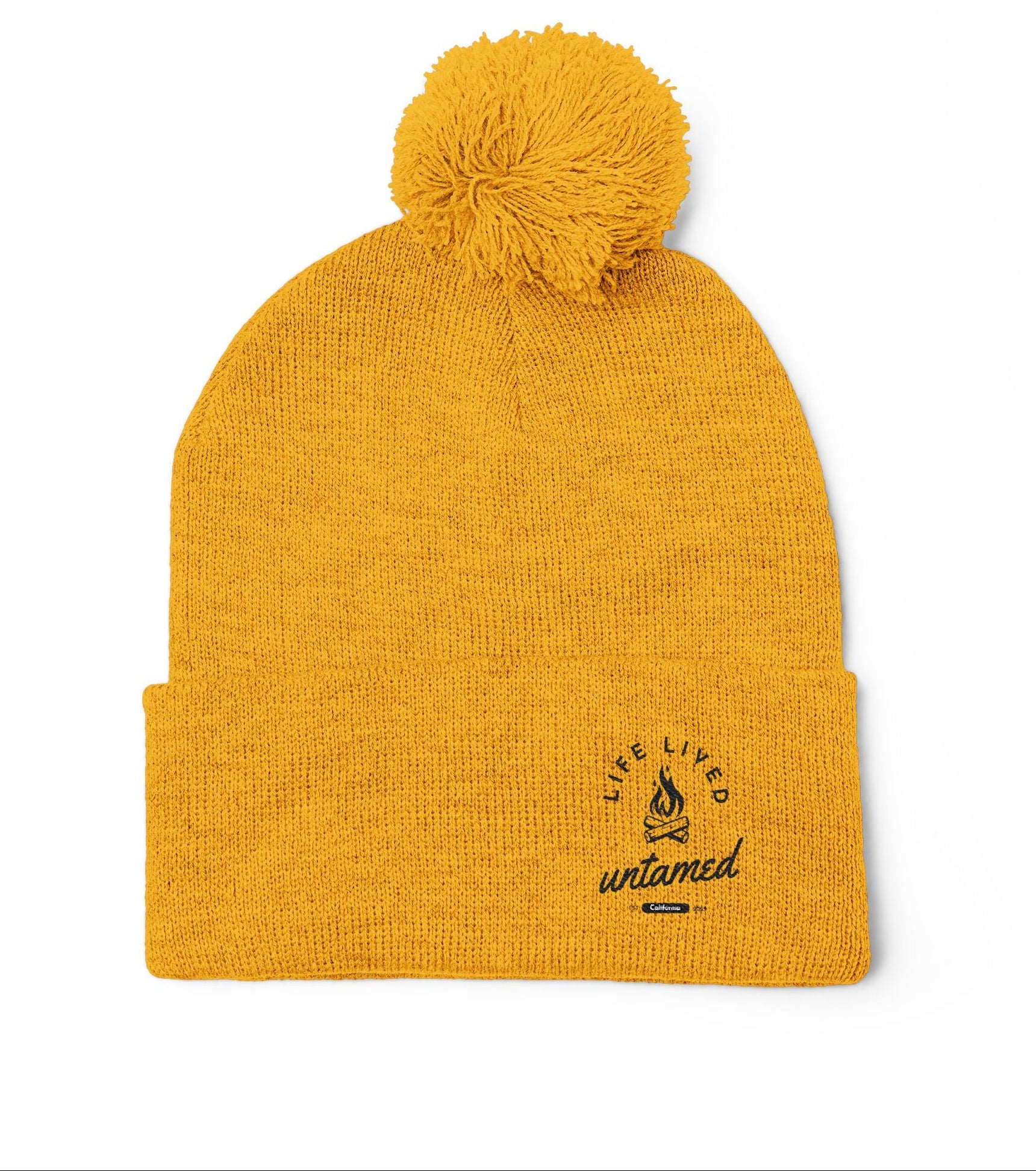 Yellow beanie with pom-pom on a white background