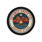 Round patch with desert landscape, stars, and campfire design on a white background