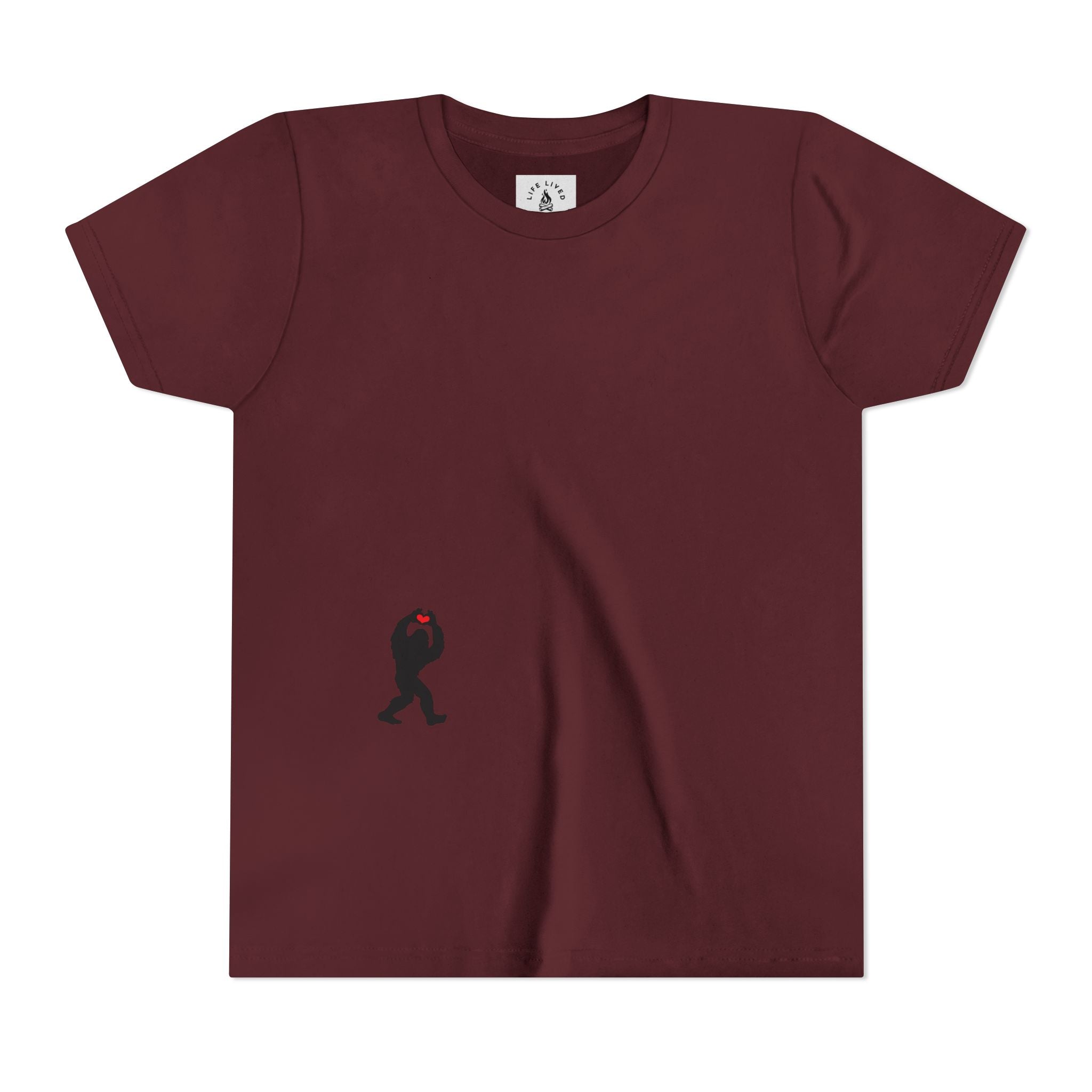 Maroon t-shirt with small black Sasquatch graphic on lower front on a white background