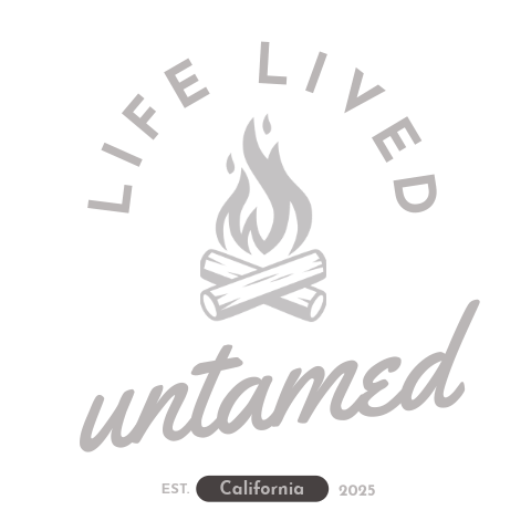 Gray 'Life Lived Untamed' logo with camp fire on a transparent background