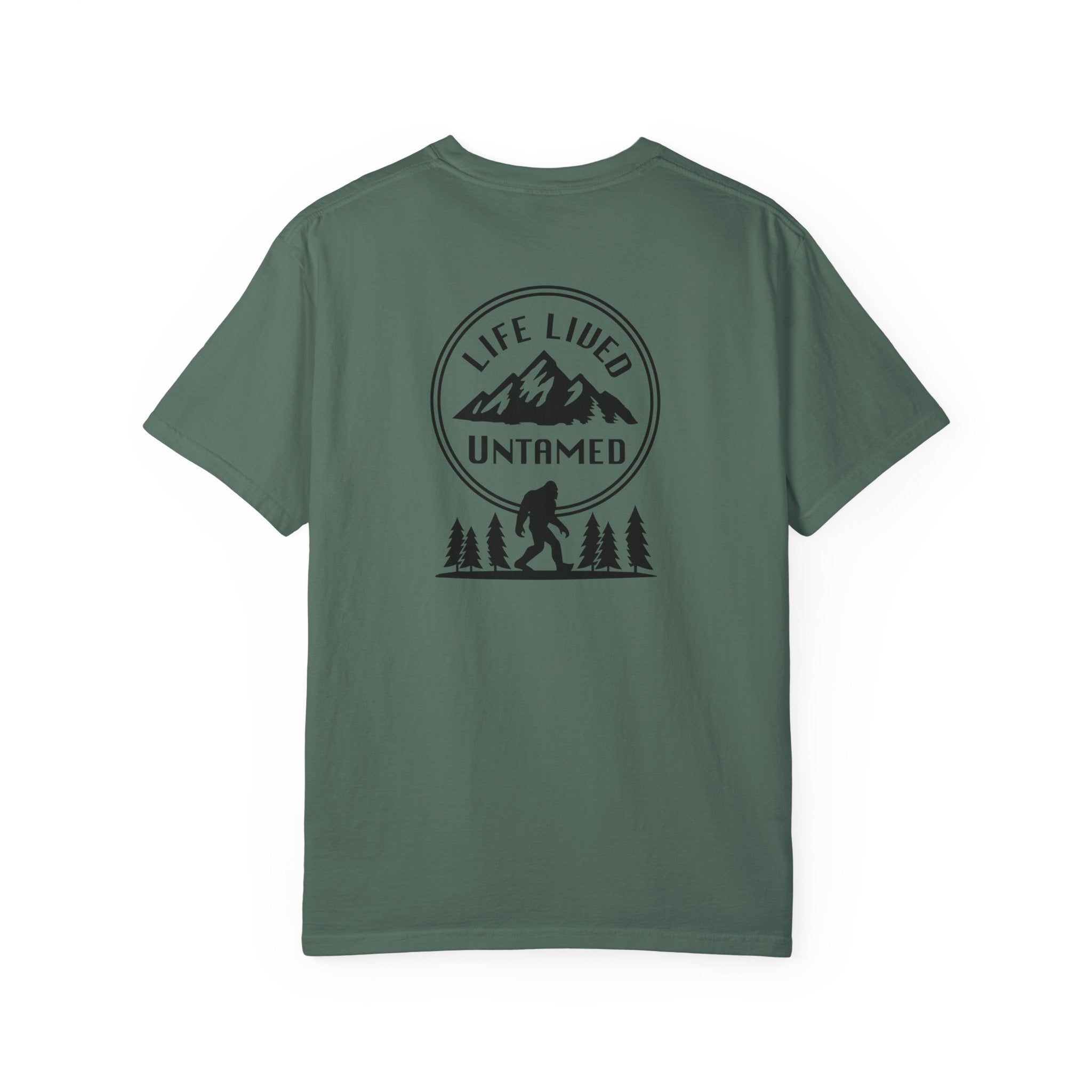 Bue spruce t-shirt with a black graphic design on the back featuring mountains, trees, and a silhouette of a Sasquatch
