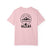 Blossom pink t-shirt with a black graphic design on the back featuring mountains, trees, and a silhouette of a person