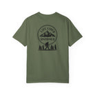 Moss Green t-shirt with a graphic design on the back featuring mountains, trees, and a silhouette of a Sasquatch