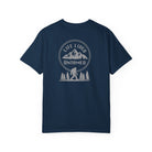True navy blue t-shirt with a black graphic design on the back featuring mountains, trees, and a silhouette of a Sasquatch