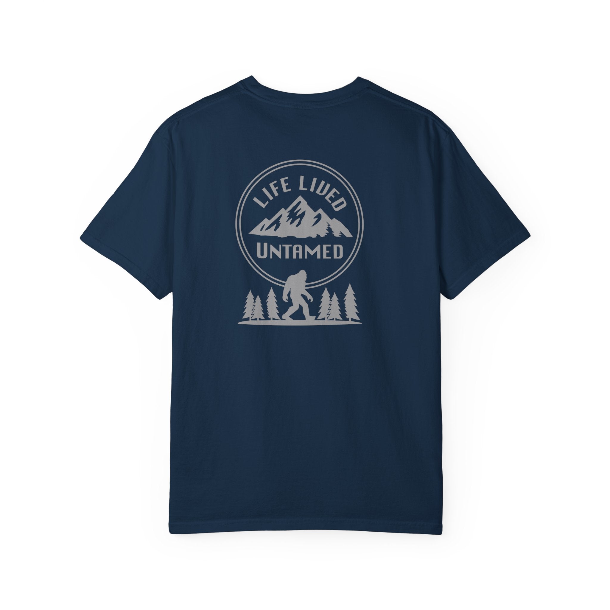 True navy blue t-shirt with a black graphic design on the back featuring mountains, trees, and a silhouette of a Sasquatch