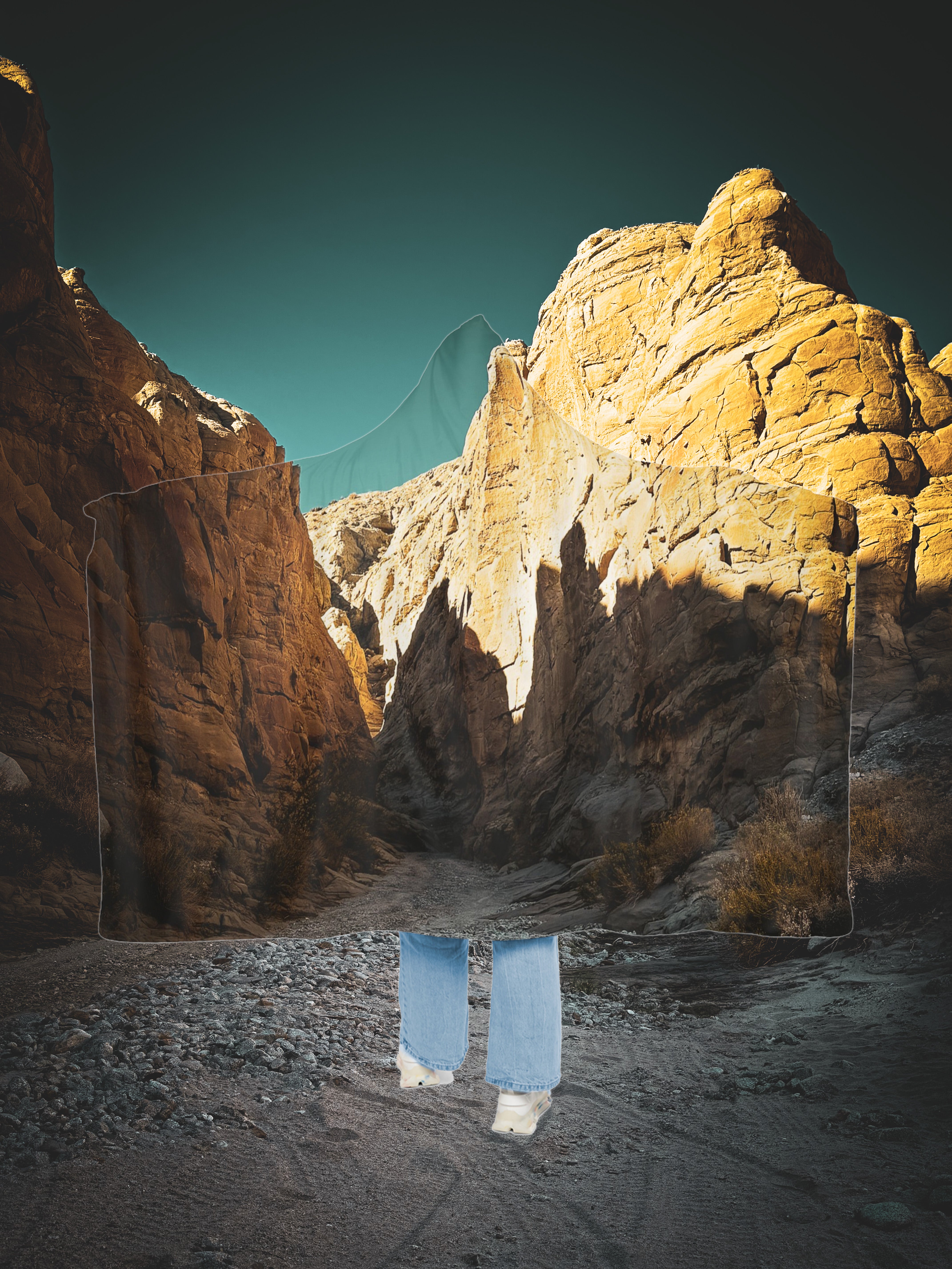 Person standing in Sandstone Canyon desert wearing a hoodie blanket wide open