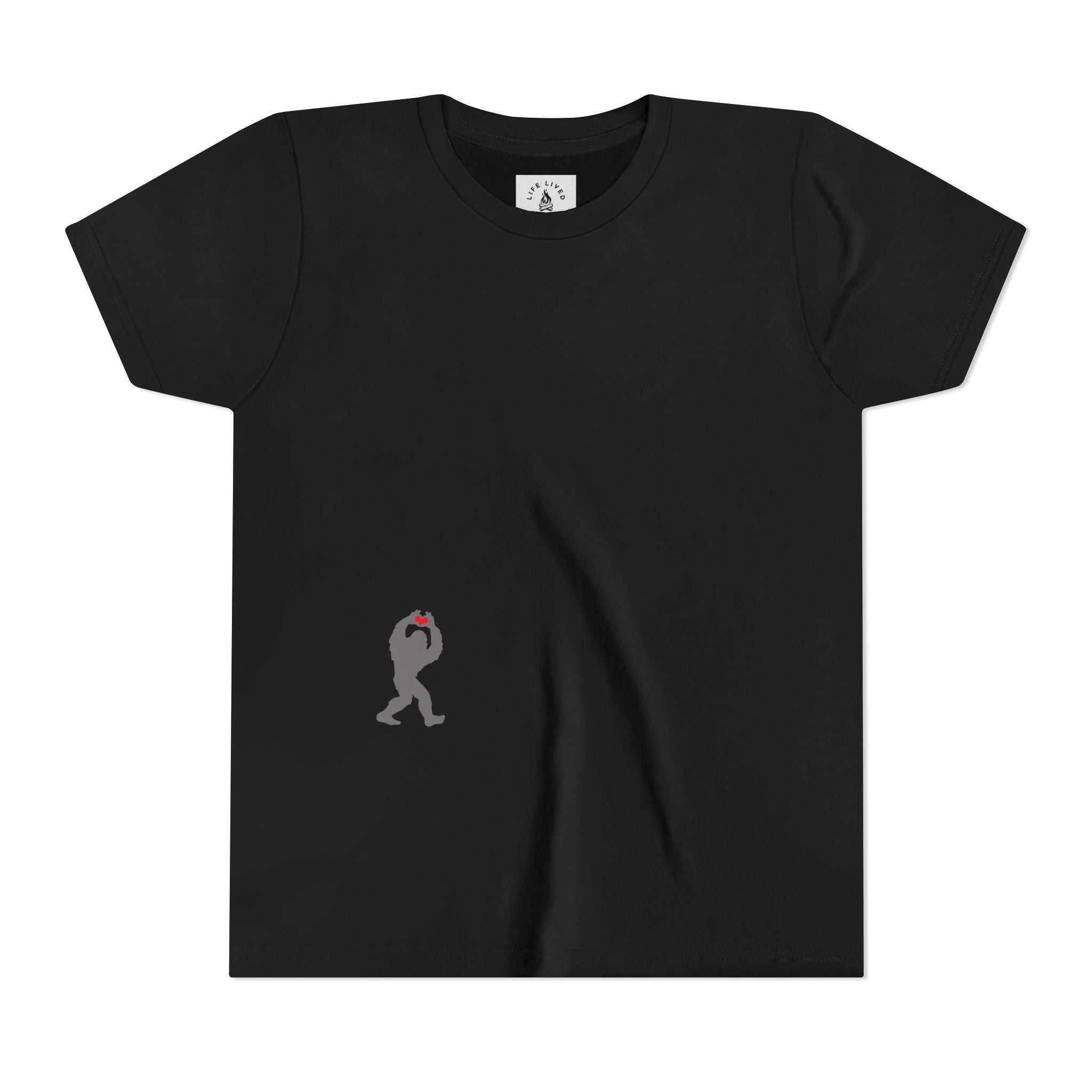 Black t-shirt with with small black Sasquatch graphic on lower front on a white background