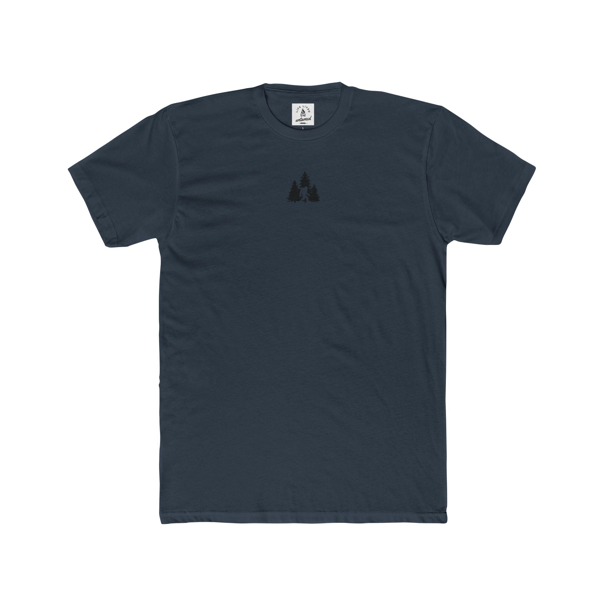 Indigo blue t-shirt with a small black Sasquatch in wilderness graphic on the chest against a white background