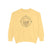 Butter Yellow sweatshirt with a compass design on a white background