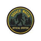 Squatch Watch Official Spotter patch with silhouette of a bigfoot and trees on a green background.