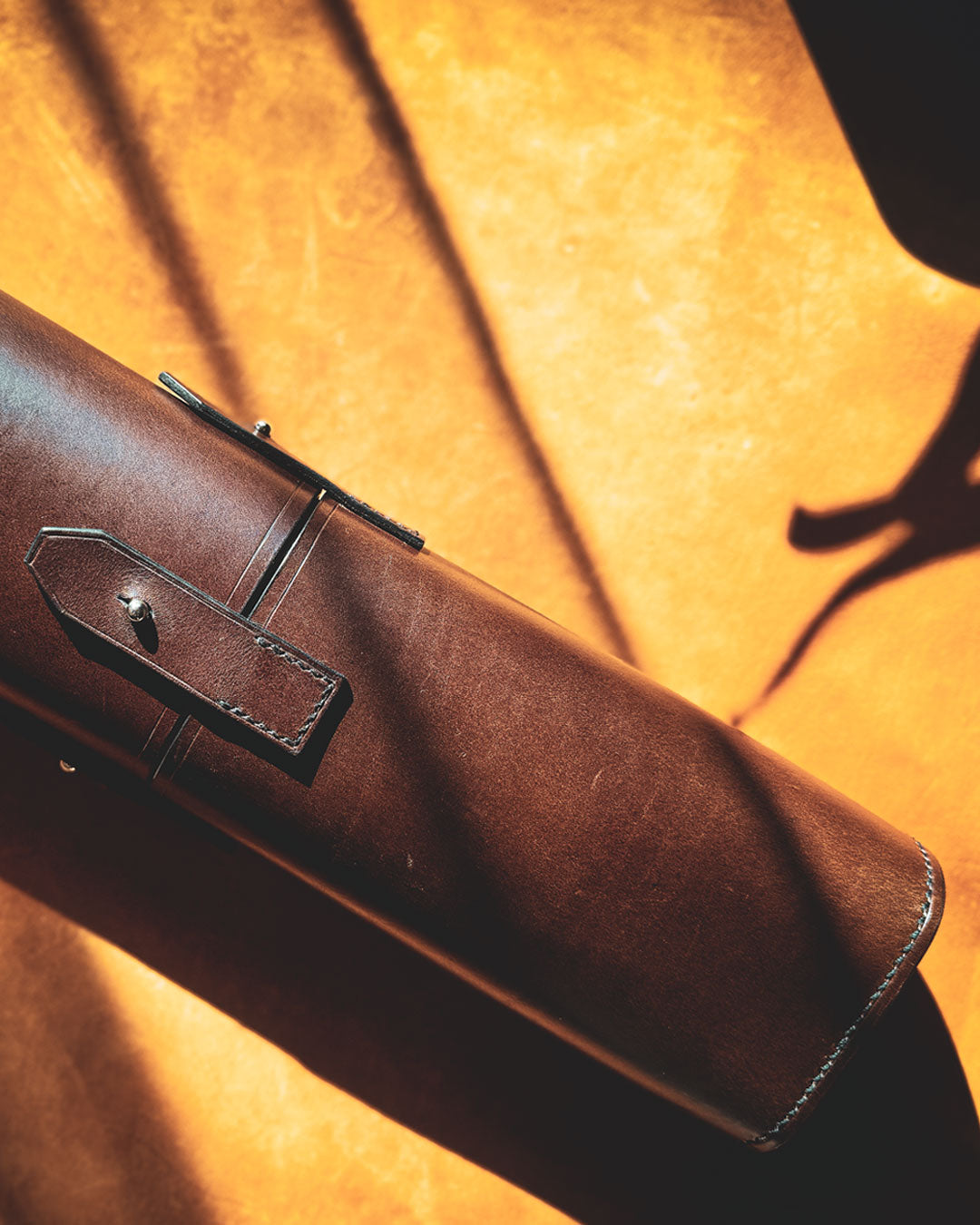 Brown leather tool-roll close up picture