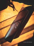 Brown leather tool-roll on a leather skin