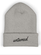 Heather gray beanie with 'untamed' text on a white background