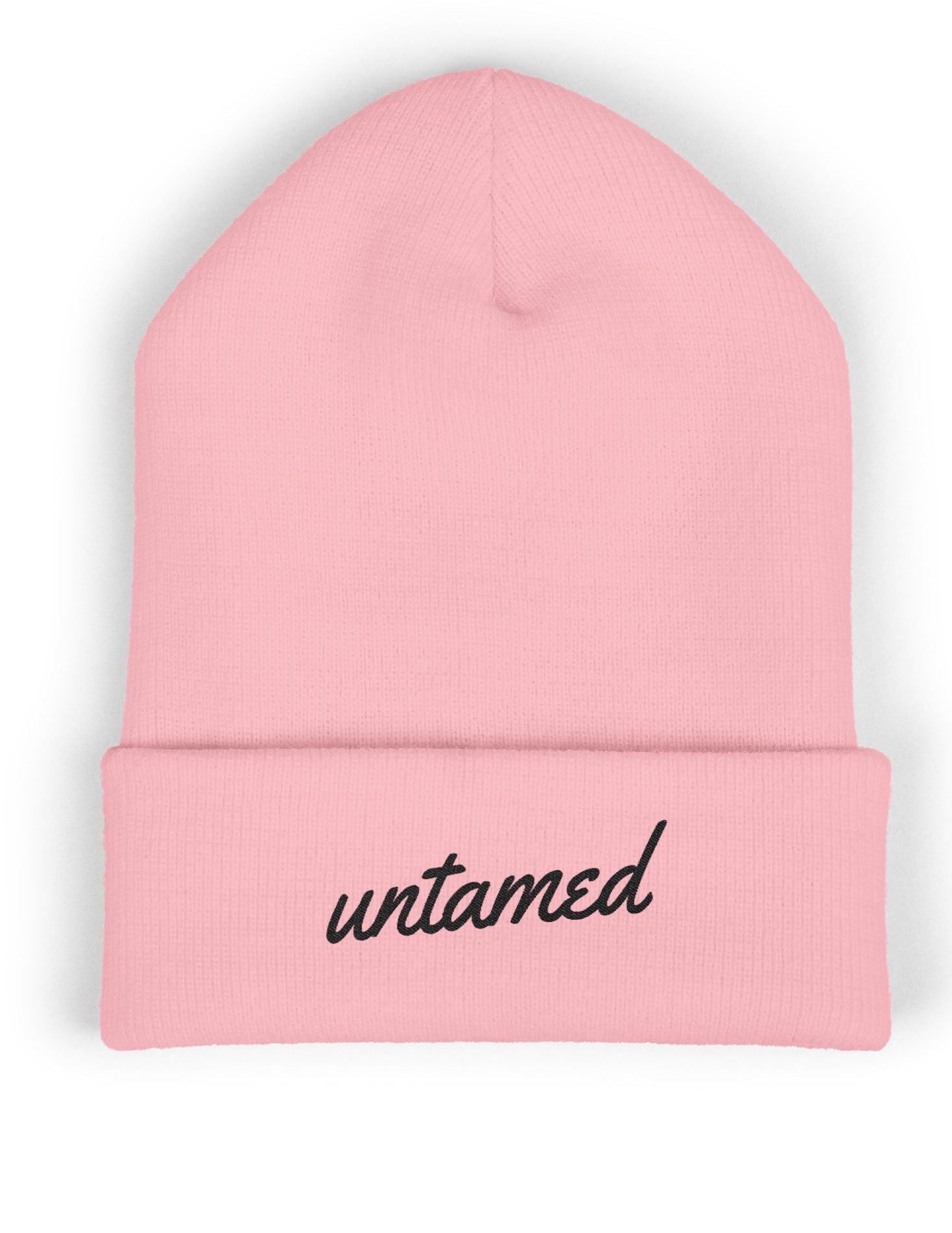Pink beanie with 'untamed' text on a white background