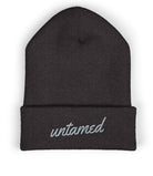 Dark gray beanie with 'untamed' embroidered on a white background