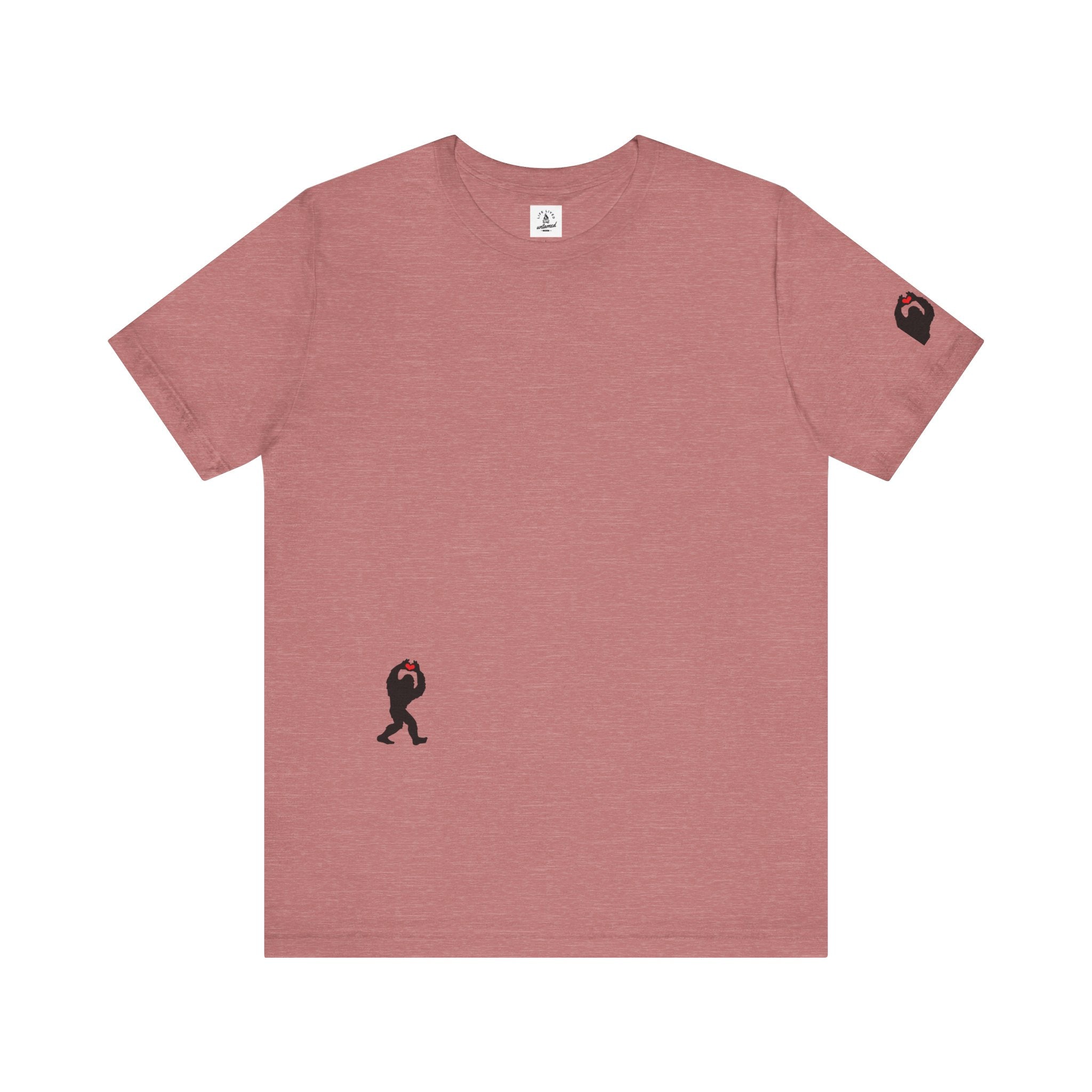 Women's heather mauve t-shirt with small black Sasquatch graphic on lower front and a sleeve on a white background