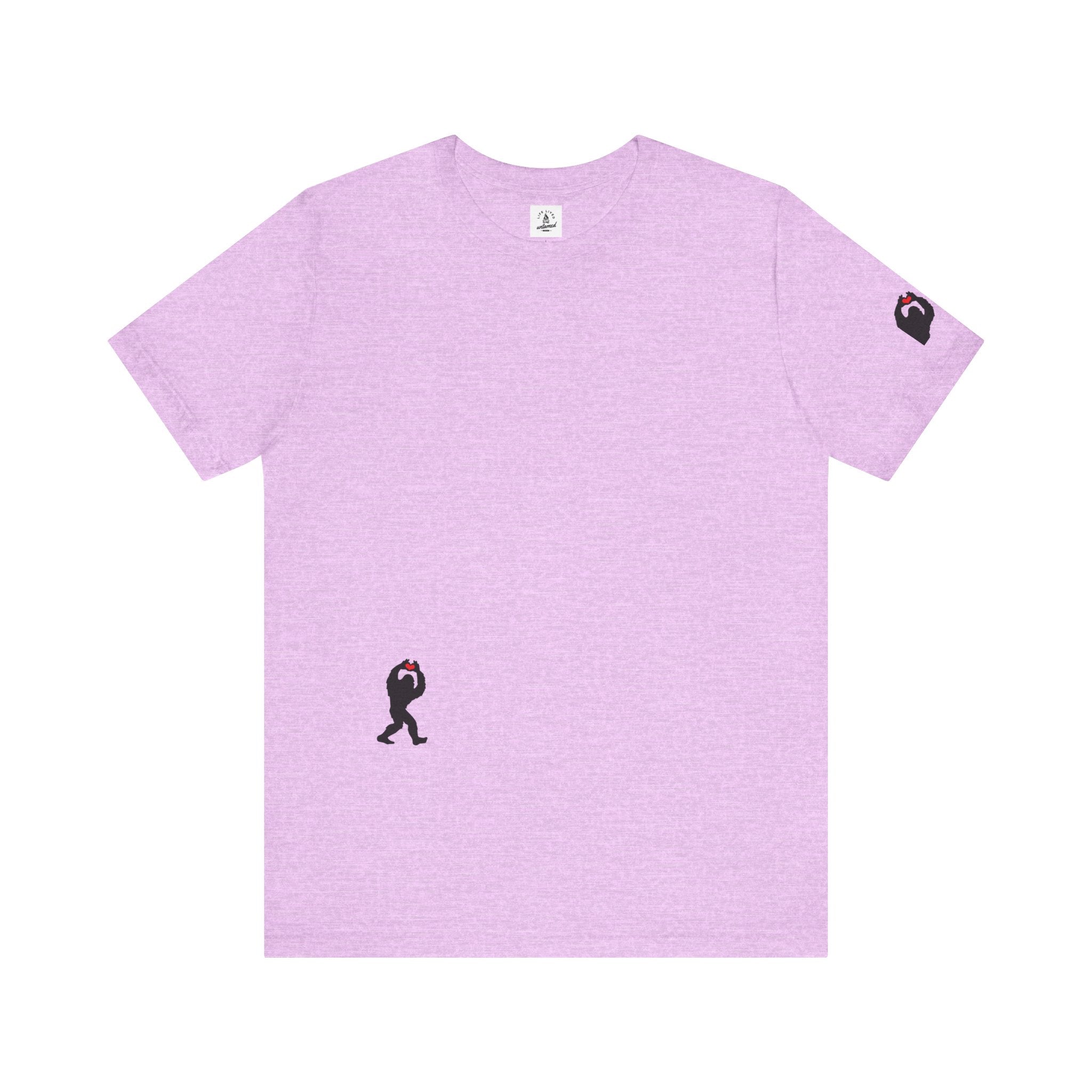 Women's lilac t-shirt with small black Sasquatch graphic on lower front and a sleeve on a white background