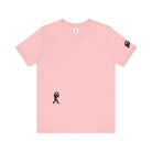 Women's pink t-shirt with small black Sasquatch graphic on lower front and a sleeve on a white background