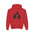 A red hoodie with a graphic of the Sasquatch in a snowy landscape with trees on a white background.