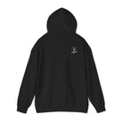A black hoodie with with a white ‘Lived Untamed' logo on the back with the hood up against a white background.