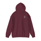 Maroon hoodie with a white ‘Lived Untamed' logo on the back against a white background.
