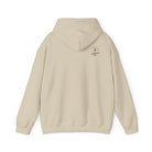 A sand hoodie with a 'Lived Untamed' logo on the back with the hood down against a white background.