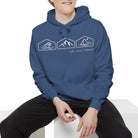 Person wearing a blue hoodie with XOG and text on a white background