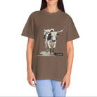 Woman wearing a brown t-shirt with a cow graphic on a white background