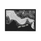 Black and white topographic design patch with 'Find Your Line' text on a white background