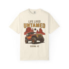 Beige t-shirt with graphic of a Jeep and desert landscape, text 'Life Lived Untamed Sedona, AZ' on a white background