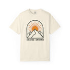Ivory t-shirt with mountain and sun graphic and 'Solstice Untamed' text on a white background