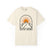 Ivory t-shirt with mountain and sun graphic and 'Solstice Untamed' text on a white background