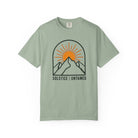 Bay green t-shirt with mountain and sun design on a white background