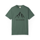 Blue Spruce Green t-shirt with a cross and roots design on a white background