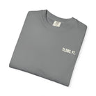 Folded gray t-shirt with '11,503. FT.' text on a white background